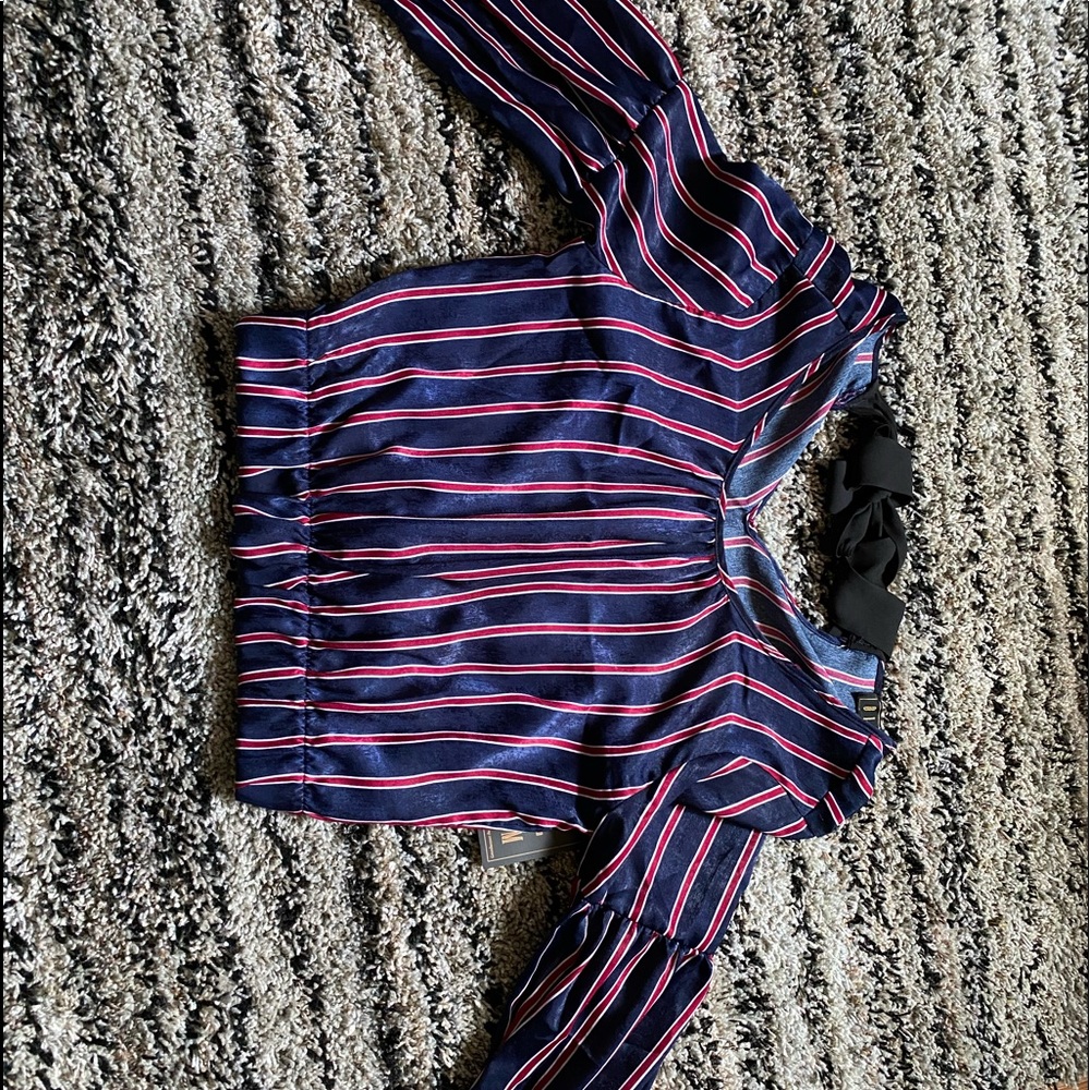 Navy blue blouse with red and white stripes